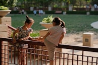 Children with disabilities playing together in a sunny park, sharing laughter.