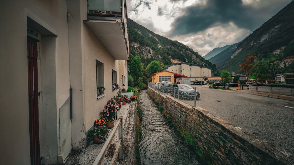 a car driving down a street next to a building