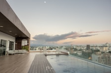 Rooftop pool with panoramic views of Puerto Vallarta at sunset.