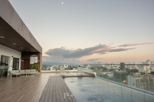Luxury villa with infinity pool overlooking Medellín cityscape at sunset