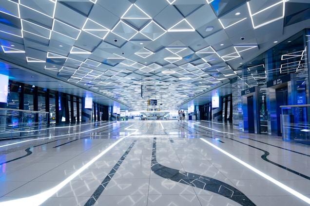 Futuristic, sleek headquarters of Fondation Rachel Asimov with digital overlays and interactive AI elements.