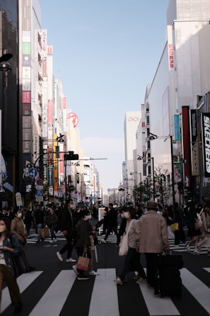 A lively cartoon scene of a bustling city street with colorful characters crossing.