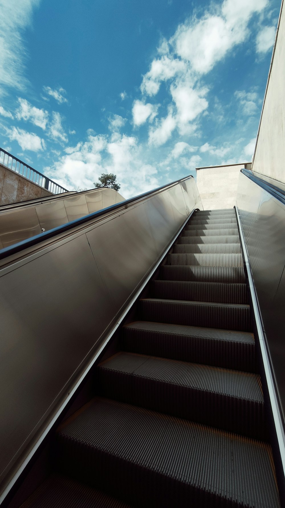 an escalator going up into the sky