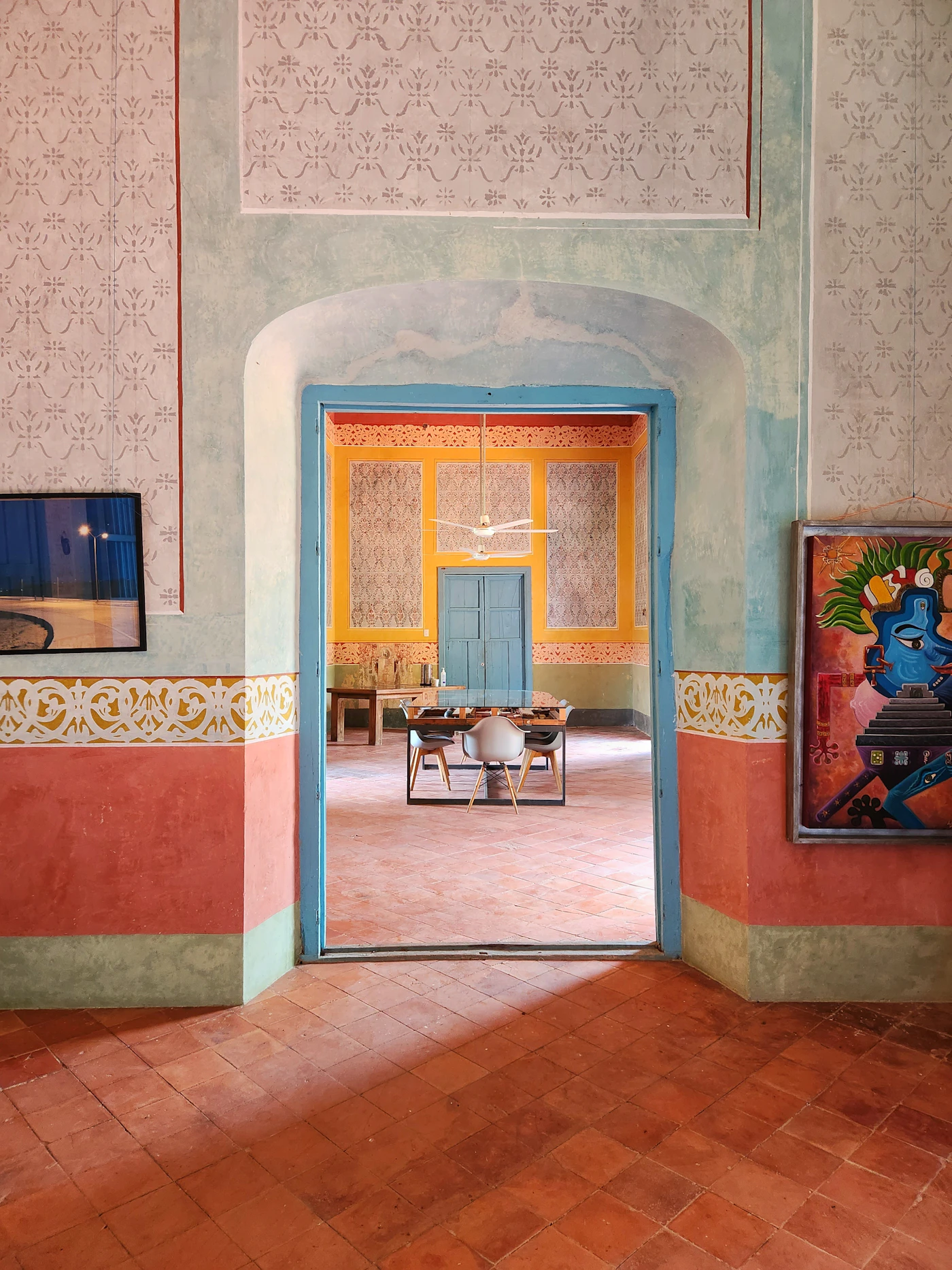 Interior of Hacienda Ticopo in Yucatan Mexico with blue colonial doorway and traditional hacienda architecture showing the heritage estate character