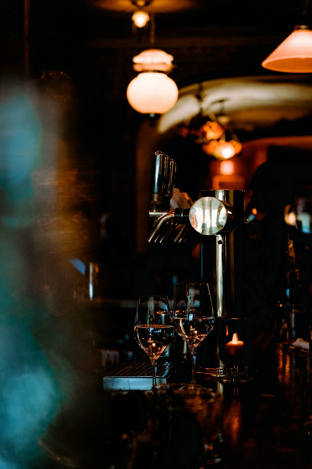 a couple of wine glasses sitting on top of a table