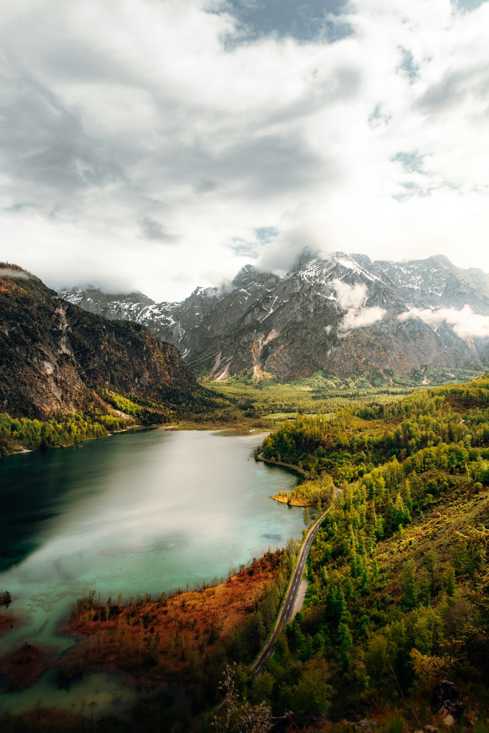 a scenic view of a lake surrounded by mountains