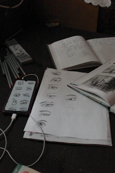 A creative workspace showing sketches and notes from personal projects.