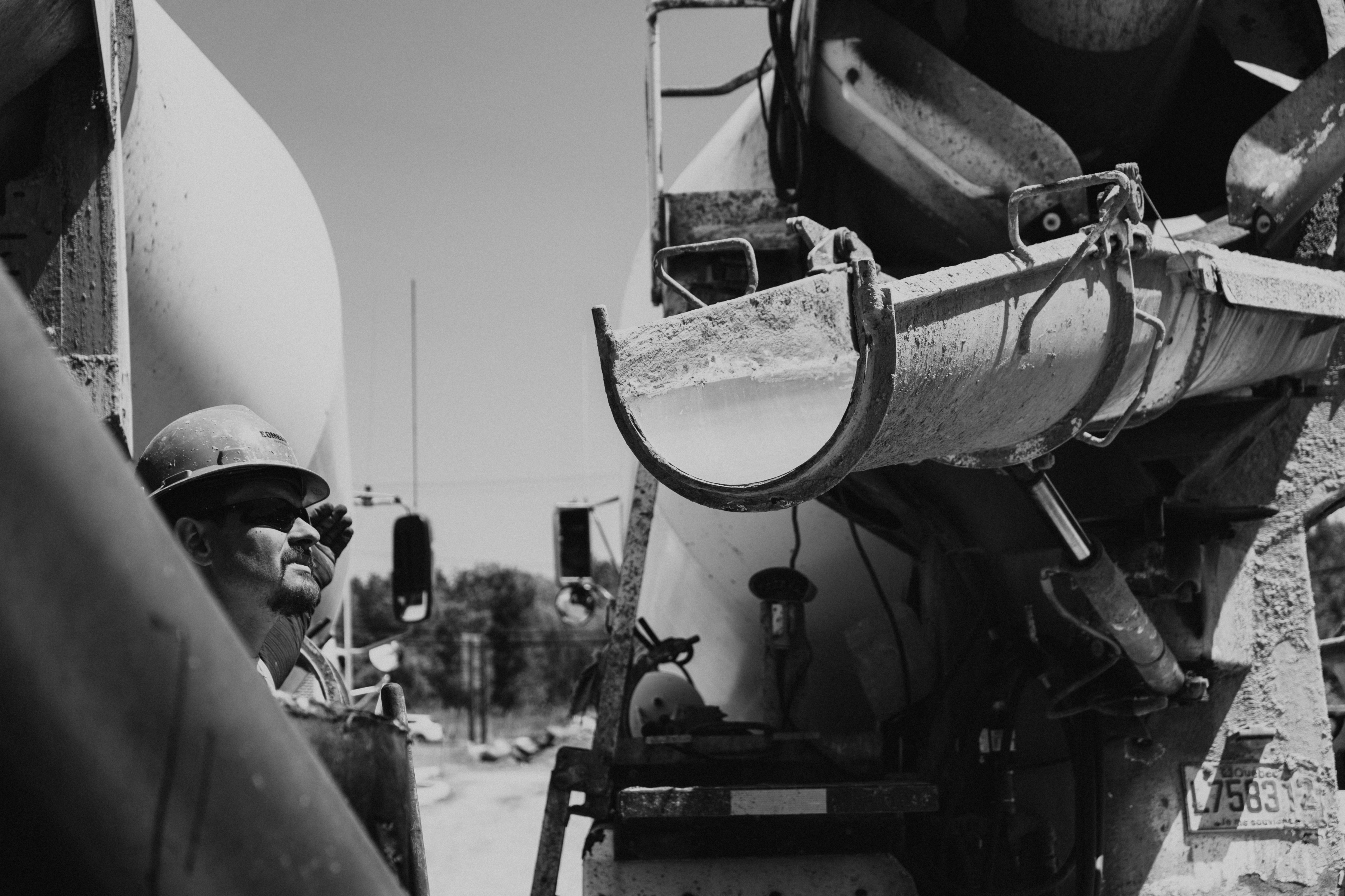 Man Next to Truck in Black and White