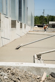 a construction worker is working on the side of a building