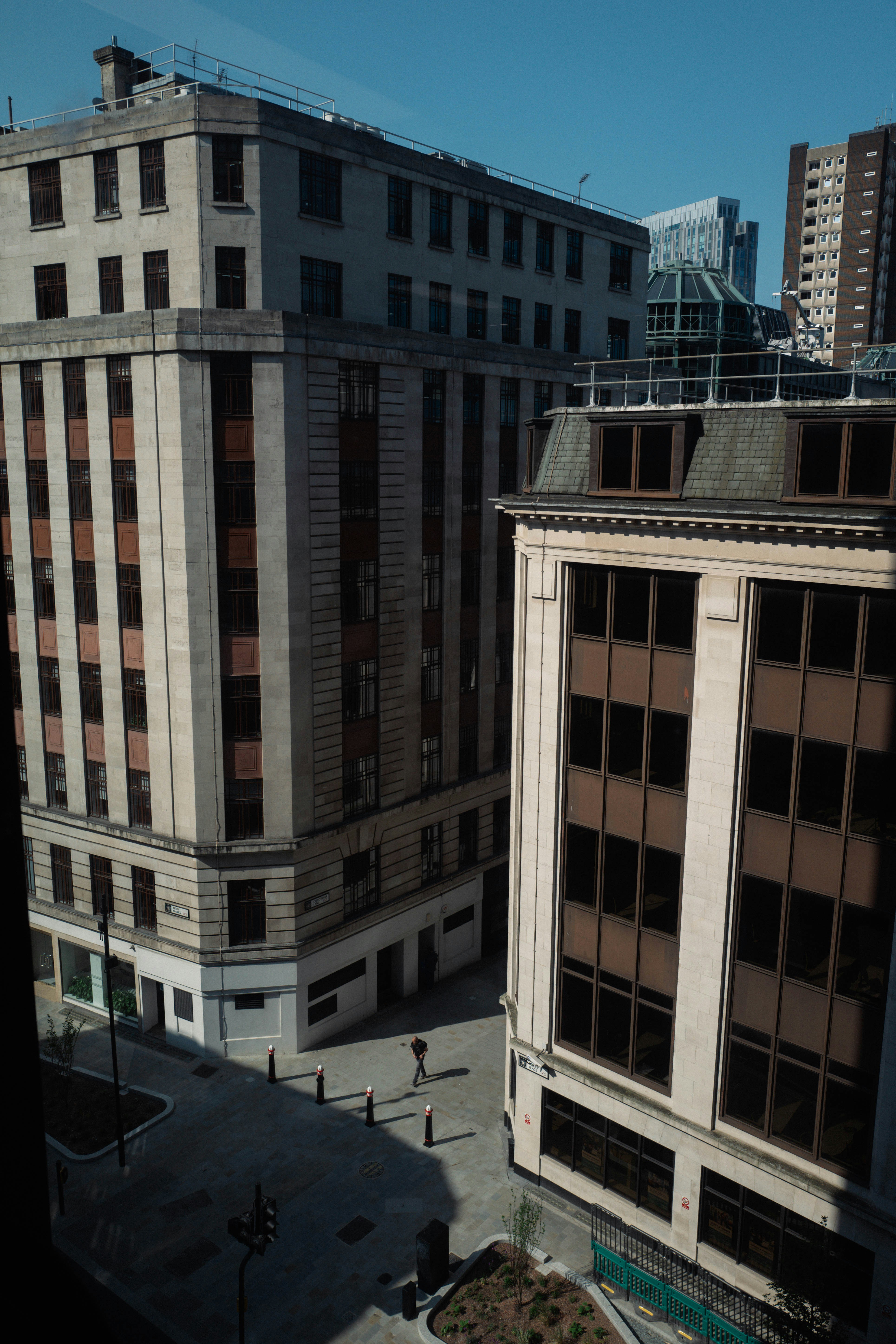 a couple of tall buildings sitting next to each other