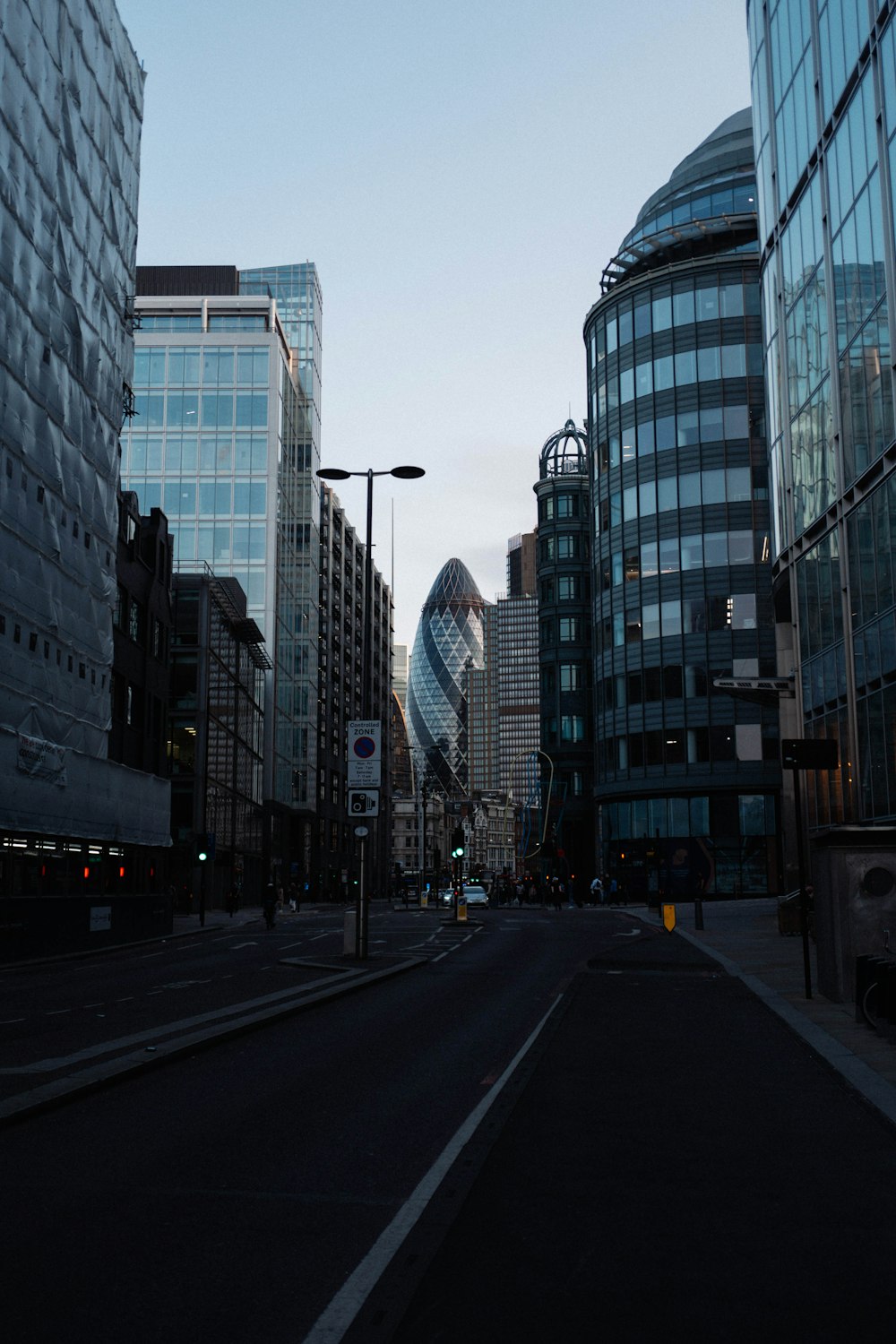 a city street with a lot of tall buildings