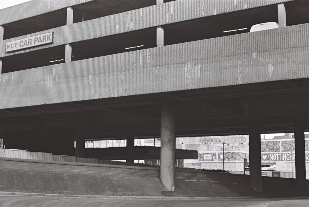 a black and white photo of a parking garage