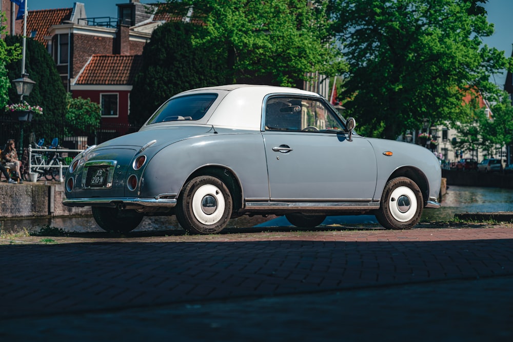 an old car parked on the side of the road