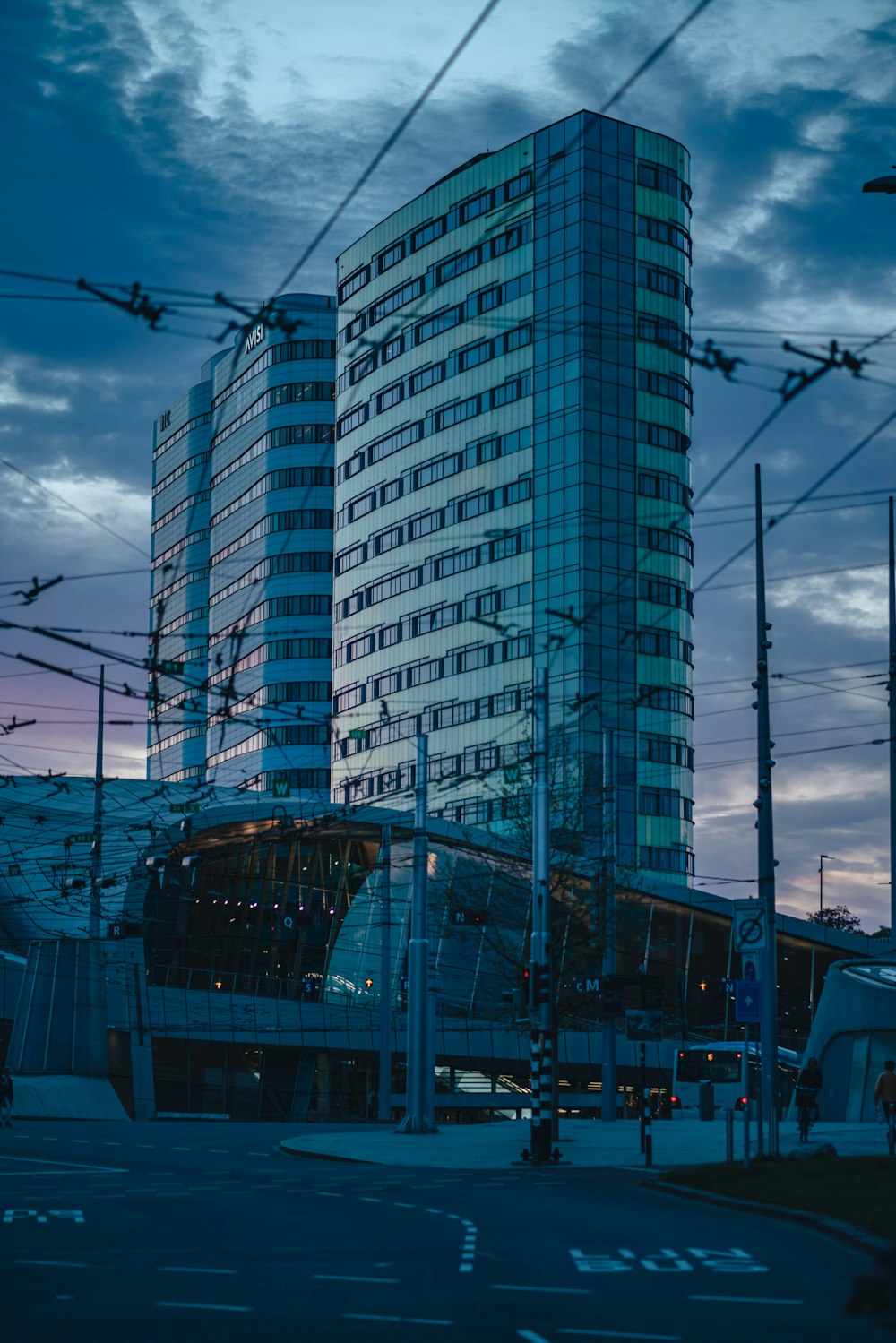 a very tall building sitting next to a street