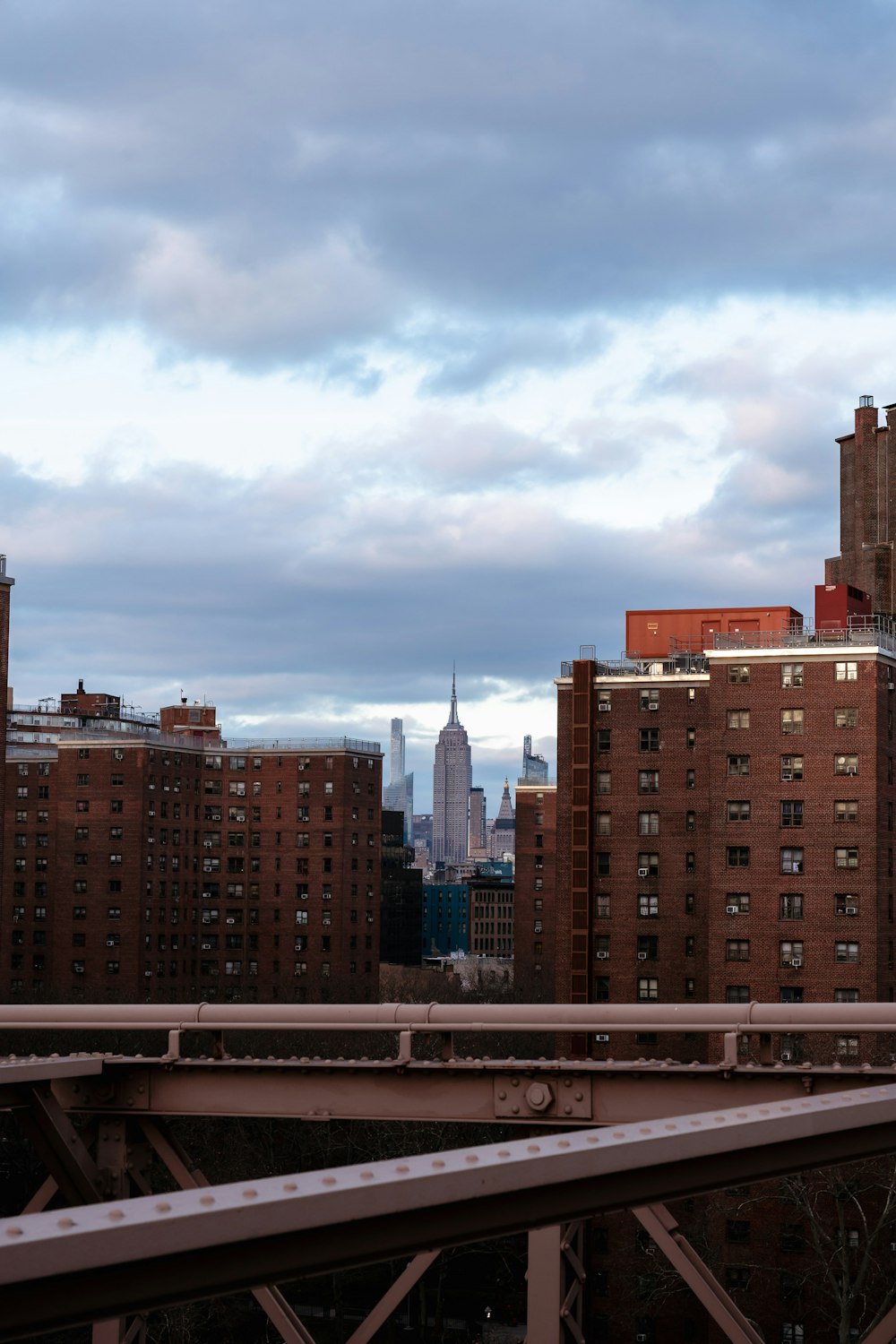 a view of a city skyline from a bridge