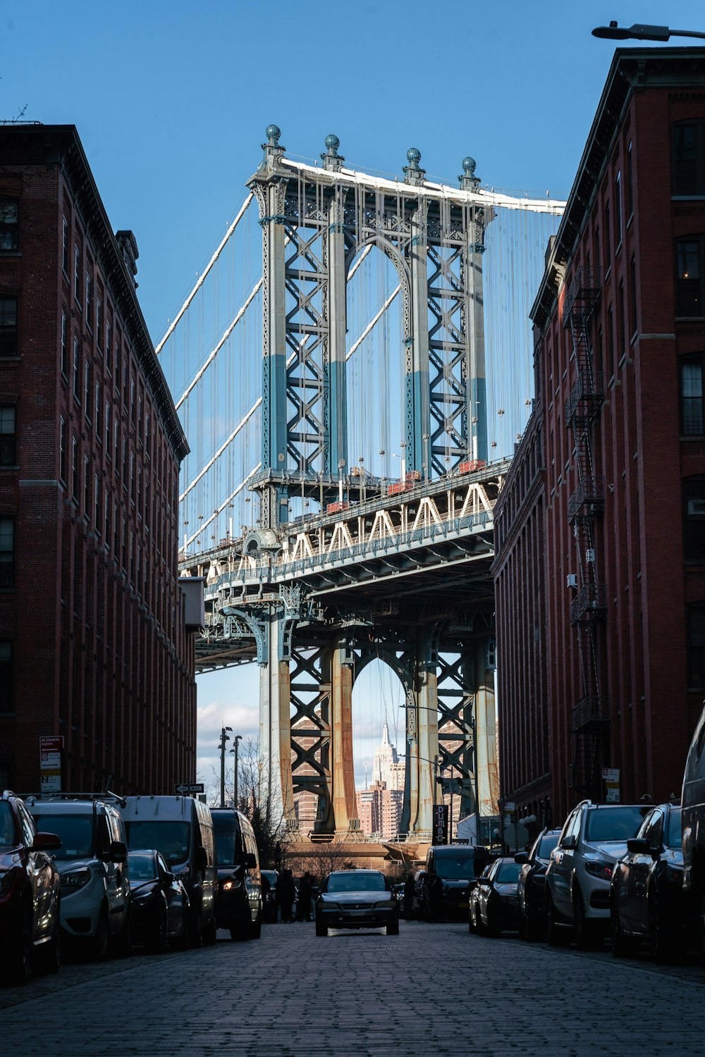 a view of the brooklyn bridge from a parking lot