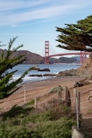 a view of the golden gate bridge from the beach