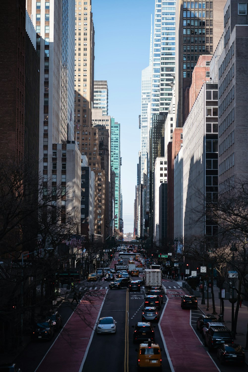 a city street filled with lots of tall buildings