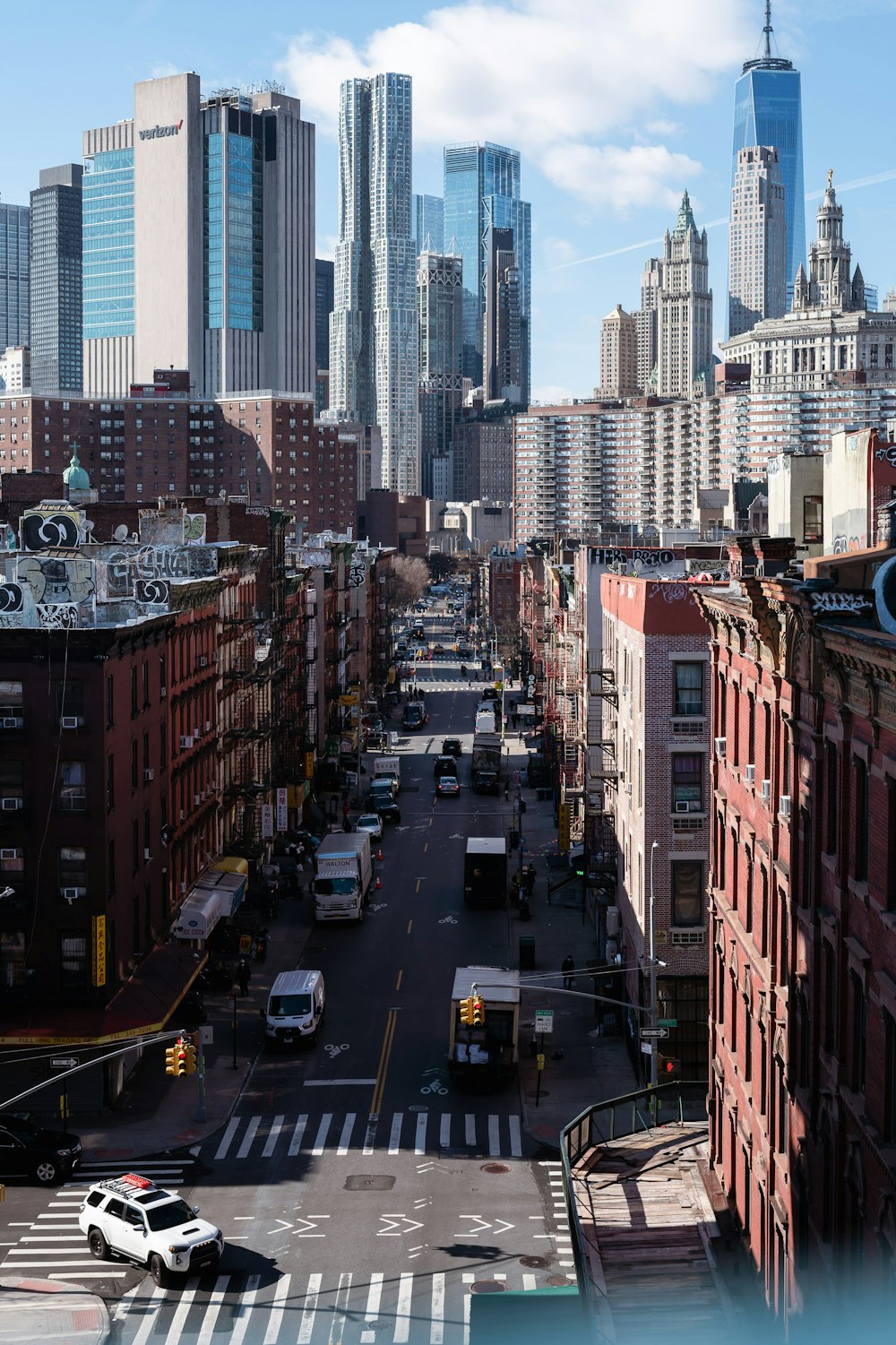 a view of a city street with tall buildings