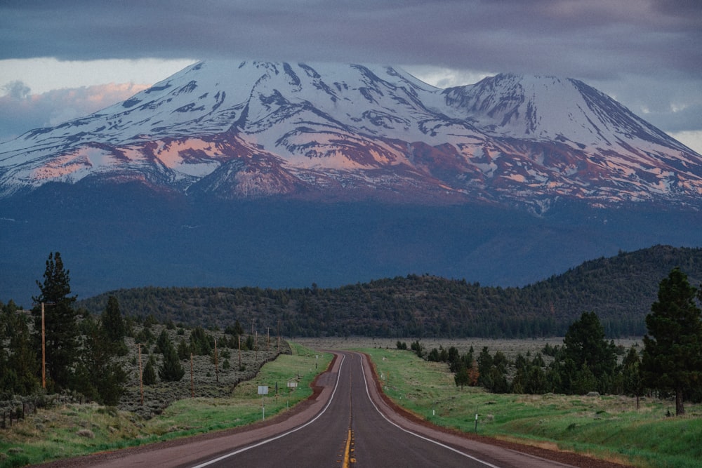 a road with a mountain in the background