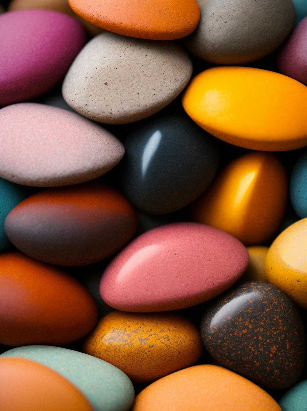 a pile of colorful rocks sitting next to each other