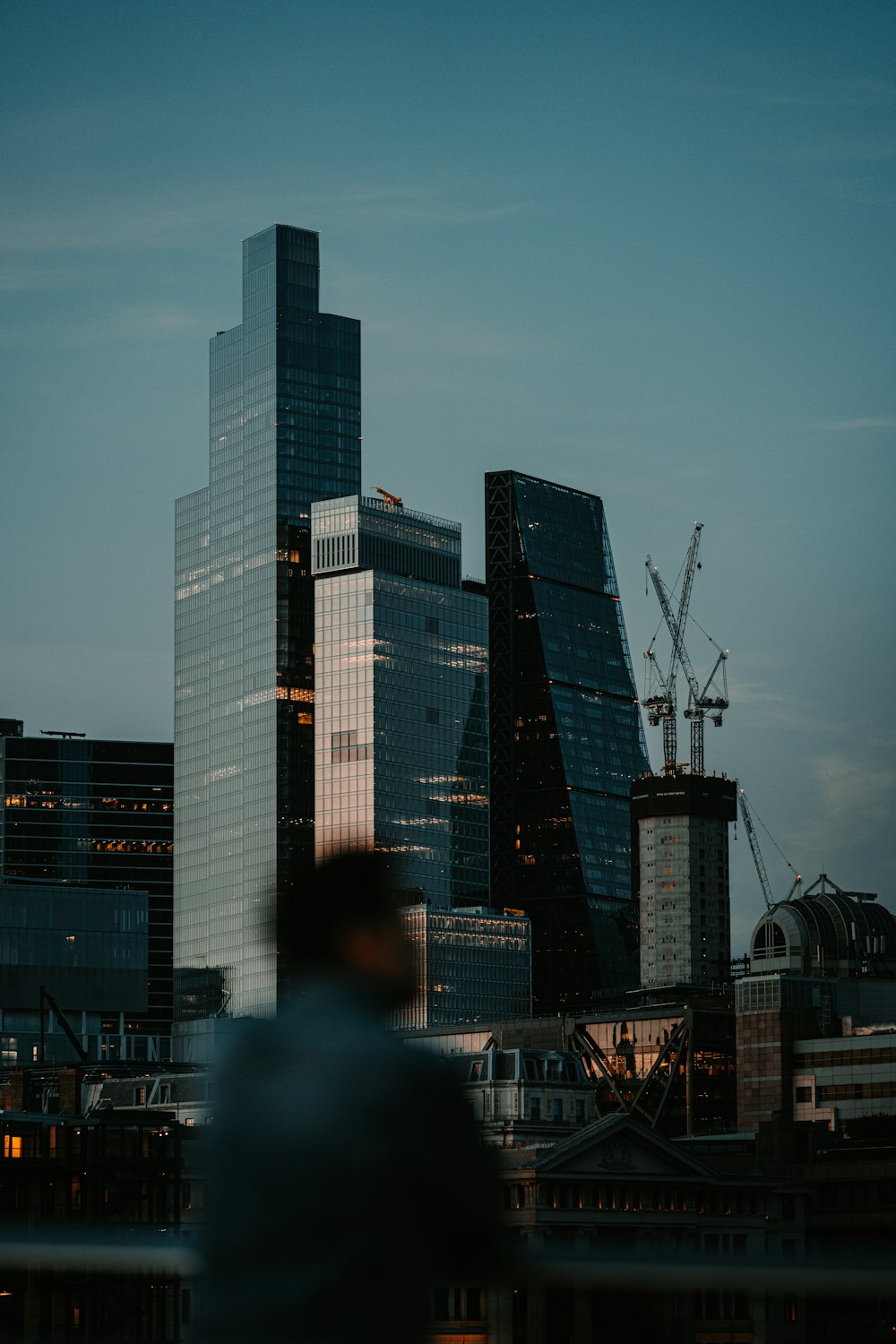 a man standing in front of a city skyline