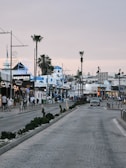 A bustling street scene in downtown Fort Myers with shops.