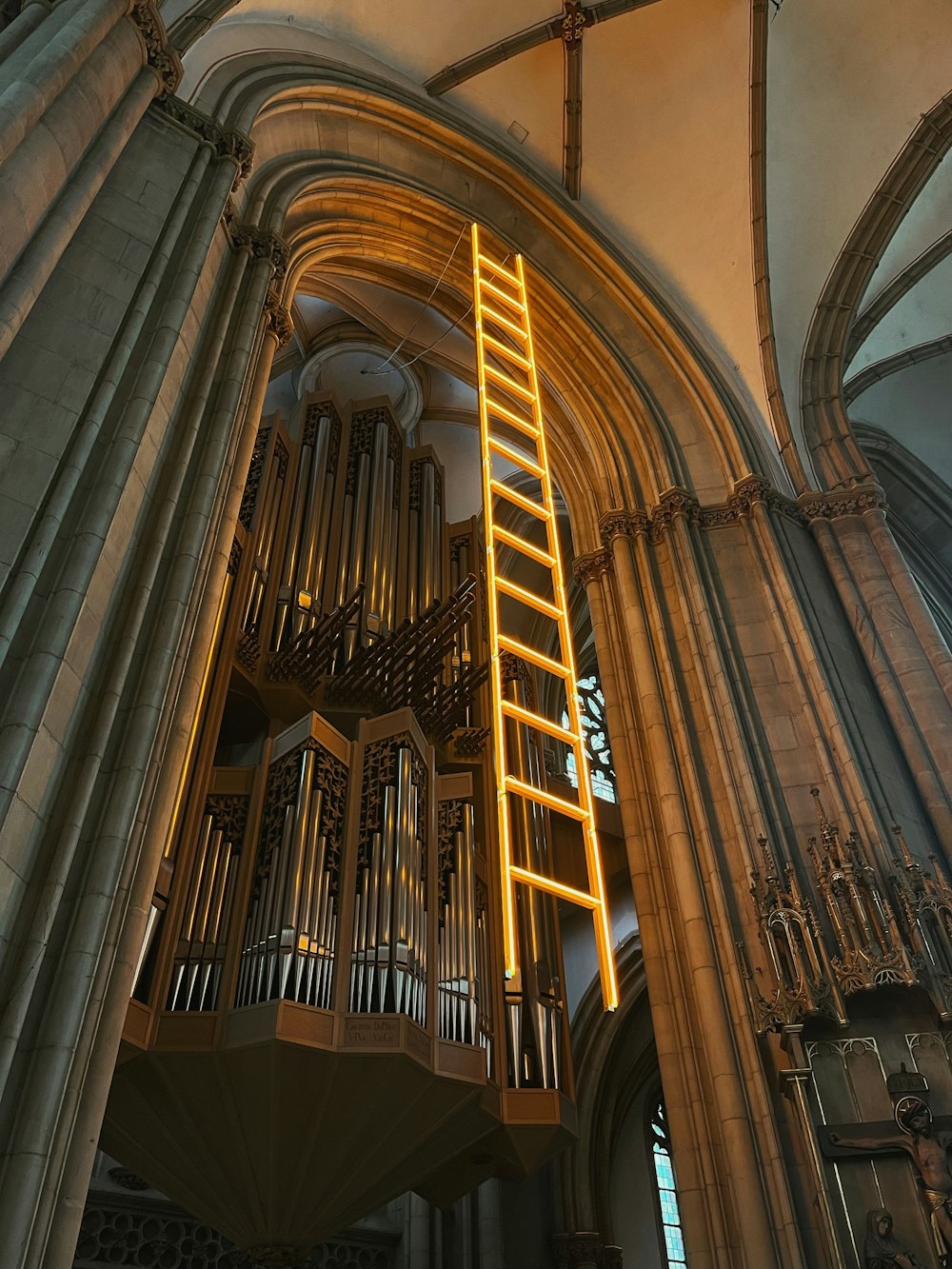 a ladder is hanging from the ceiling of a cathedral
