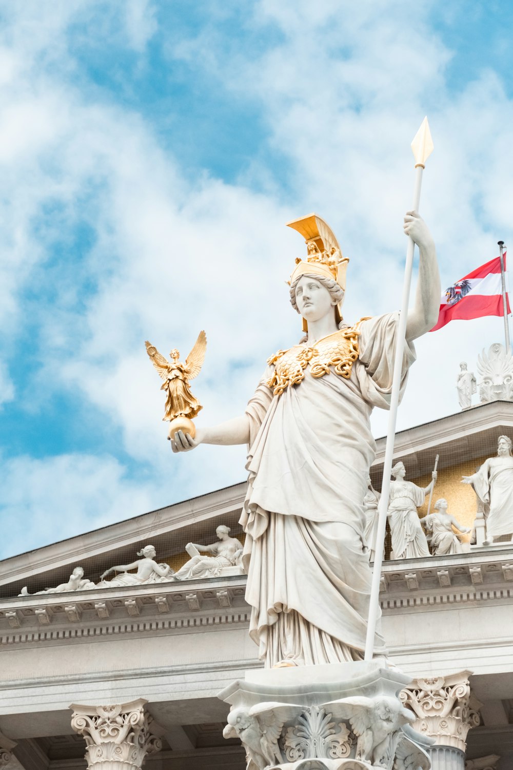 a statue of a lady liberty holding a flag