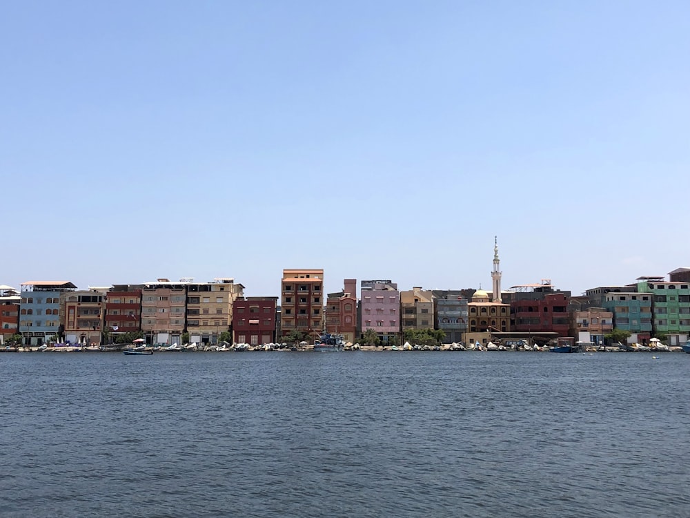 a large body of water with a city in the background