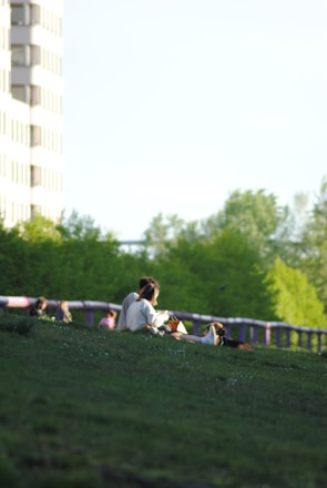 A serene outdoor gathering with people enjoying cannabis in a natural setting.
