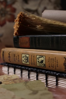 a stack of books sitting on top of a table