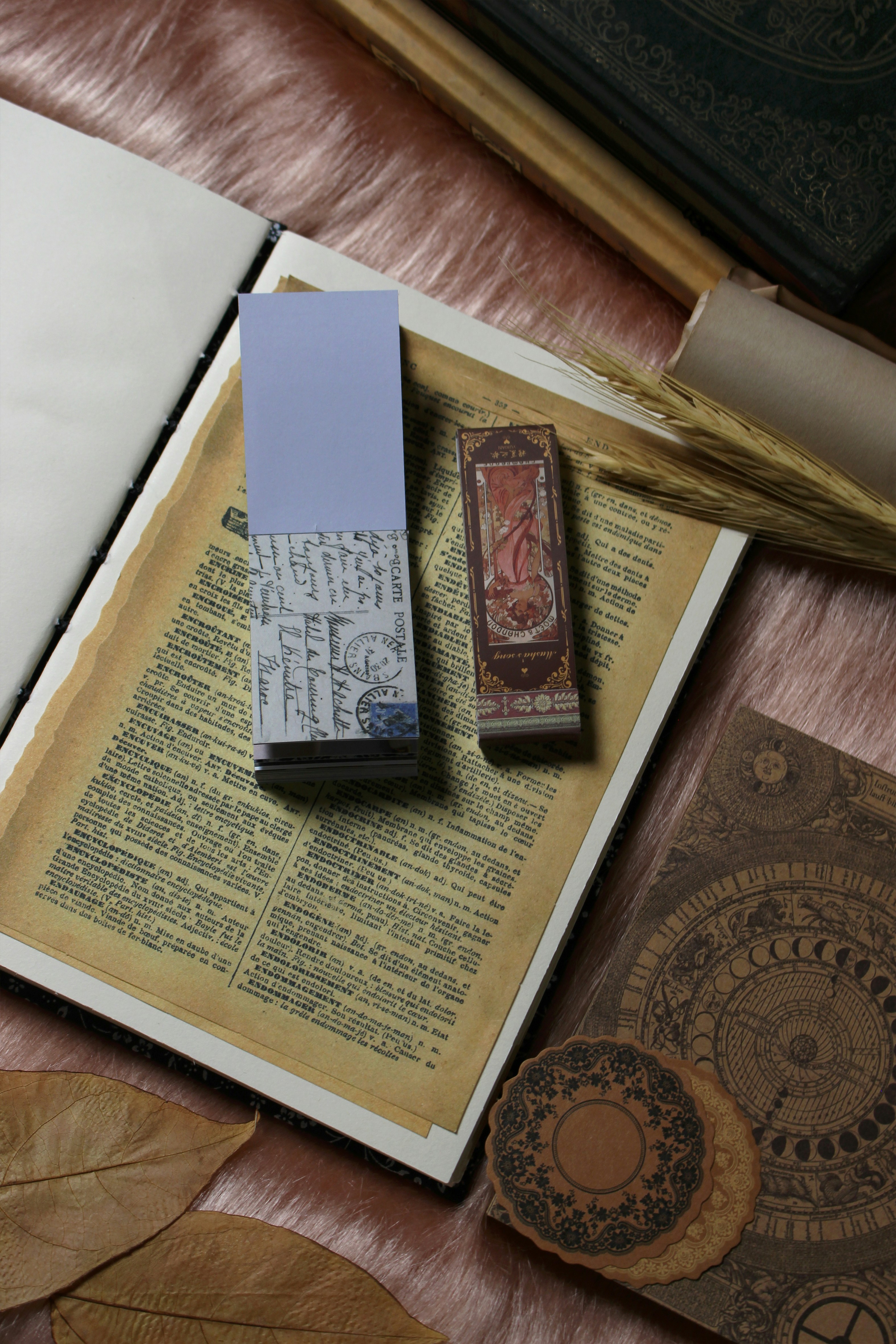 a book with a stamp and a pen on top of it