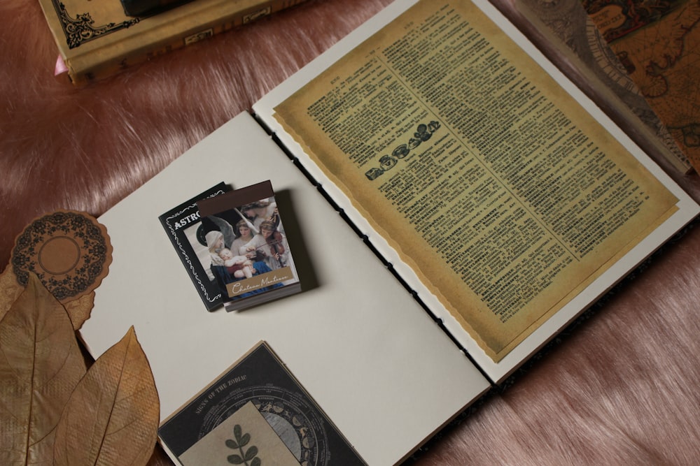 an open book sitting on top of a wooden table