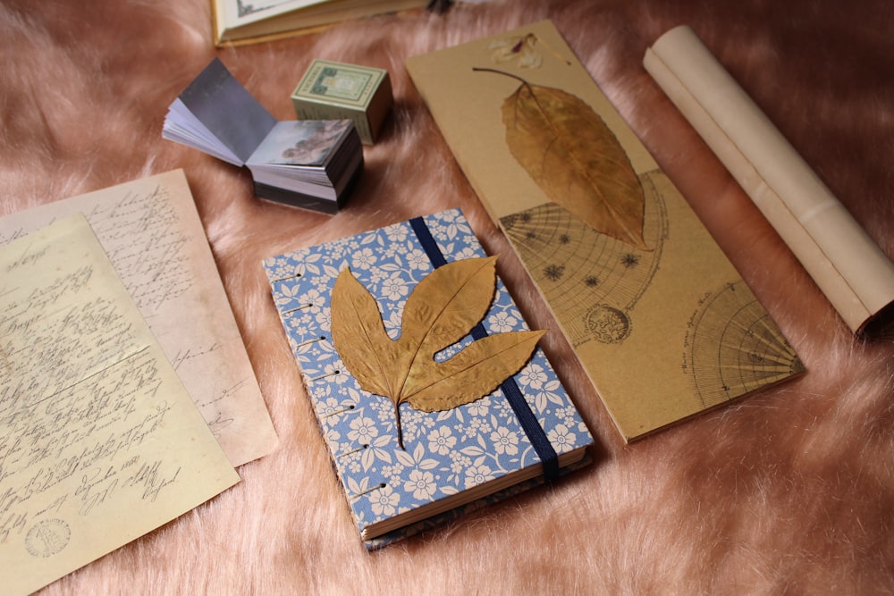 a table topped with lots of books and papers