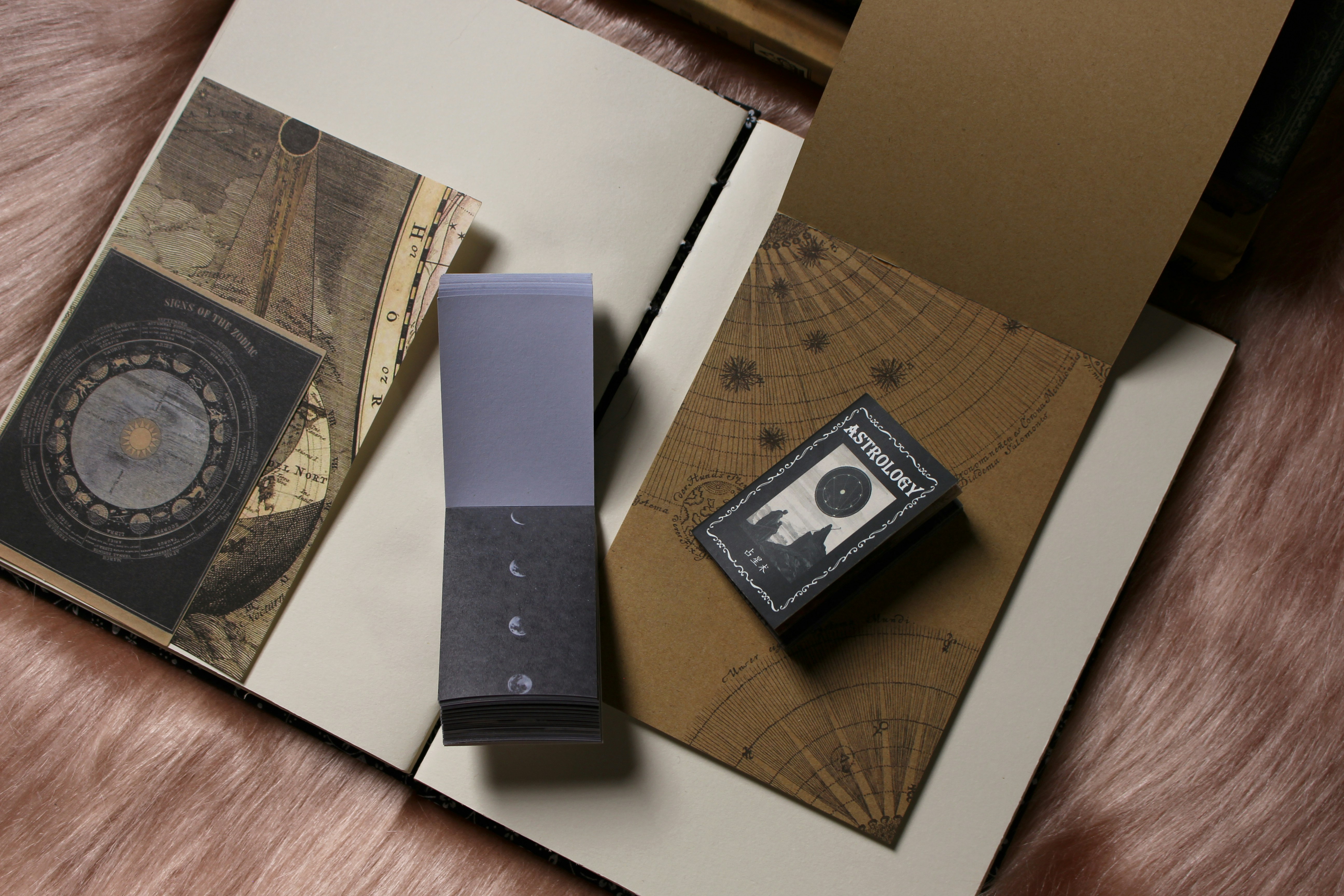 a close up of a cell phone near a book