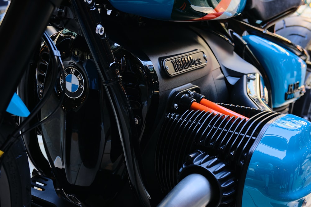 a close up of a blue and black motorcycle