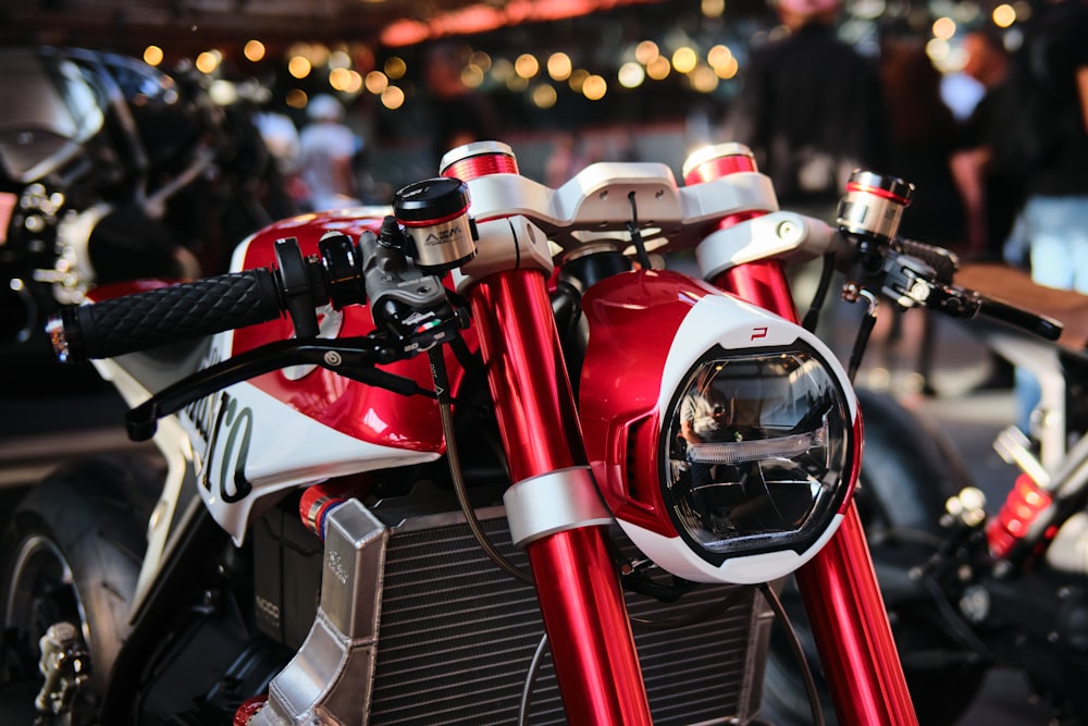 a close up of a red and white motorcycle