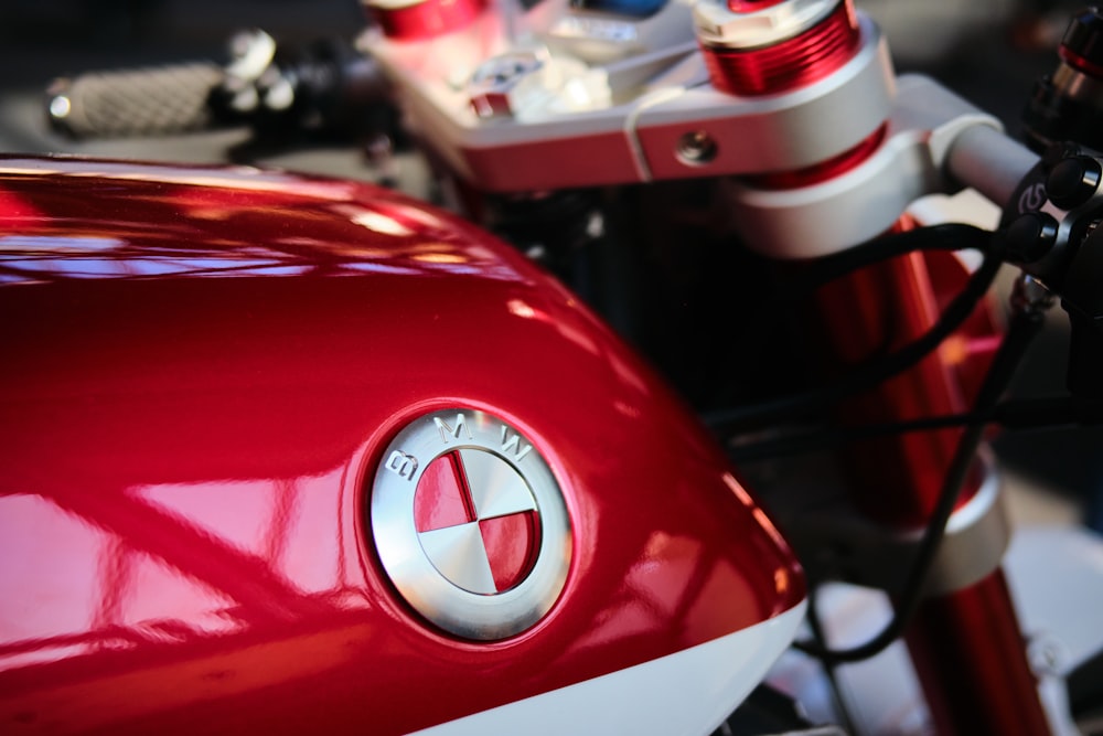 a close up of a red and white motorcycle