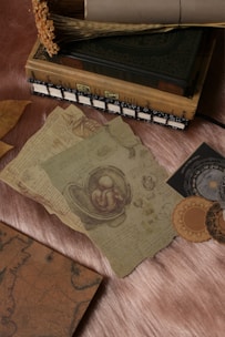a table topped with lots of books and papers