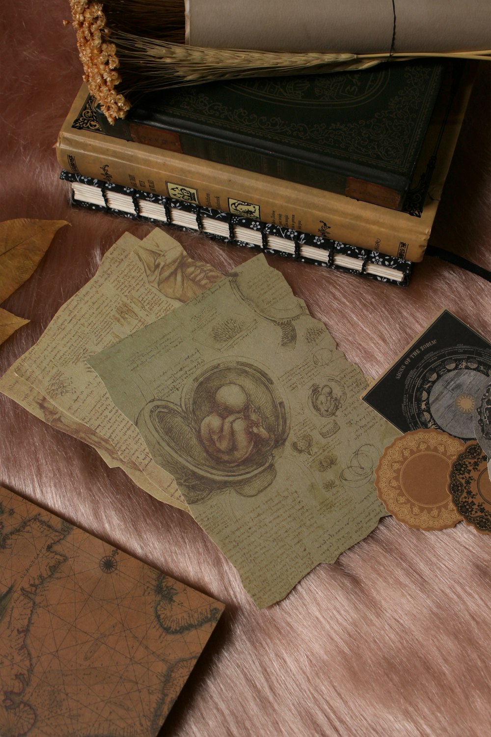 a table topped with lots of books and papers