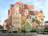 a large mural of a building on the side of a street