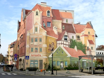 a large mural of a building on the side of a street