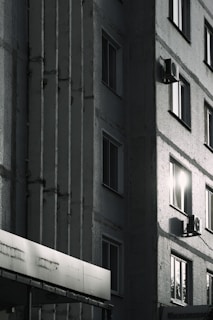 Close-up of a freshly applied thermal insulation layer on a building facade under clear sunlight.