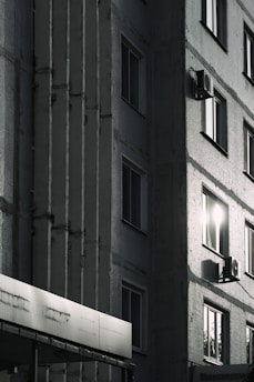 Close-up of a freshly applied thermal insulation layer on a building facade under clear sunlight.