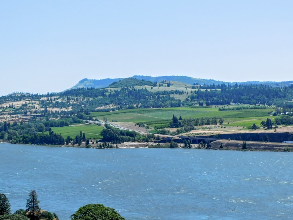 a view of a large body of water with mountains in the background