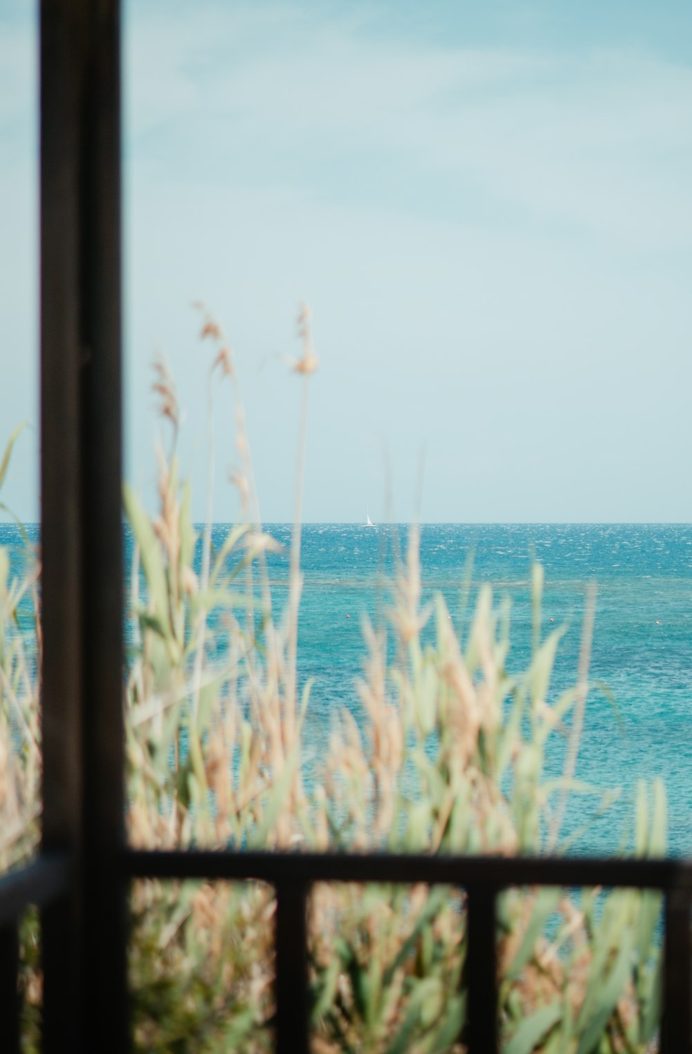 a view of the ocean through a window