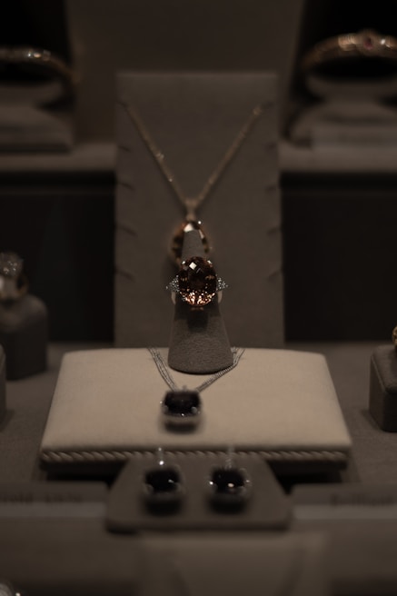 A contemporary jewelry design displayed in an artistic setting.