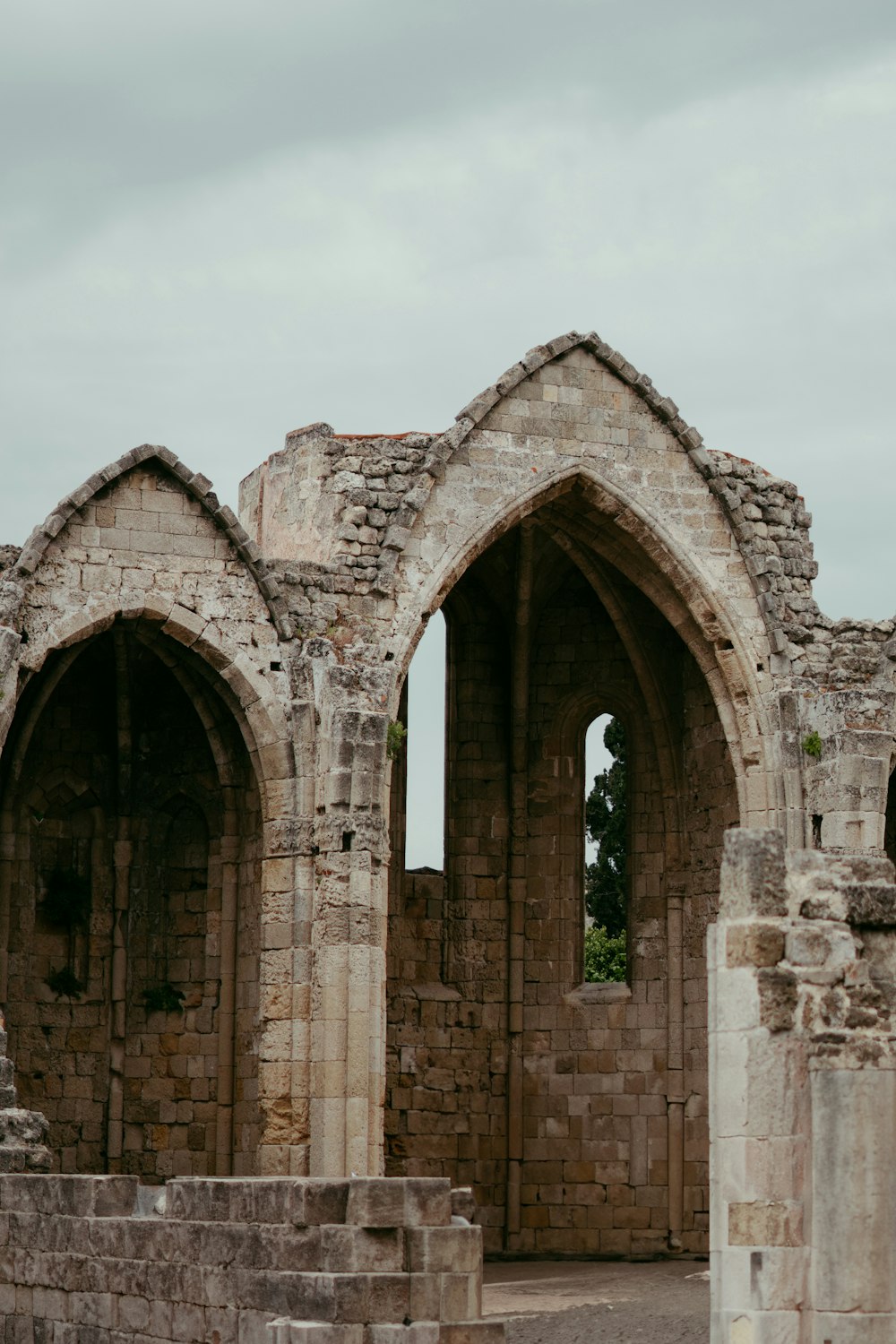 a stone building with two arched doorways