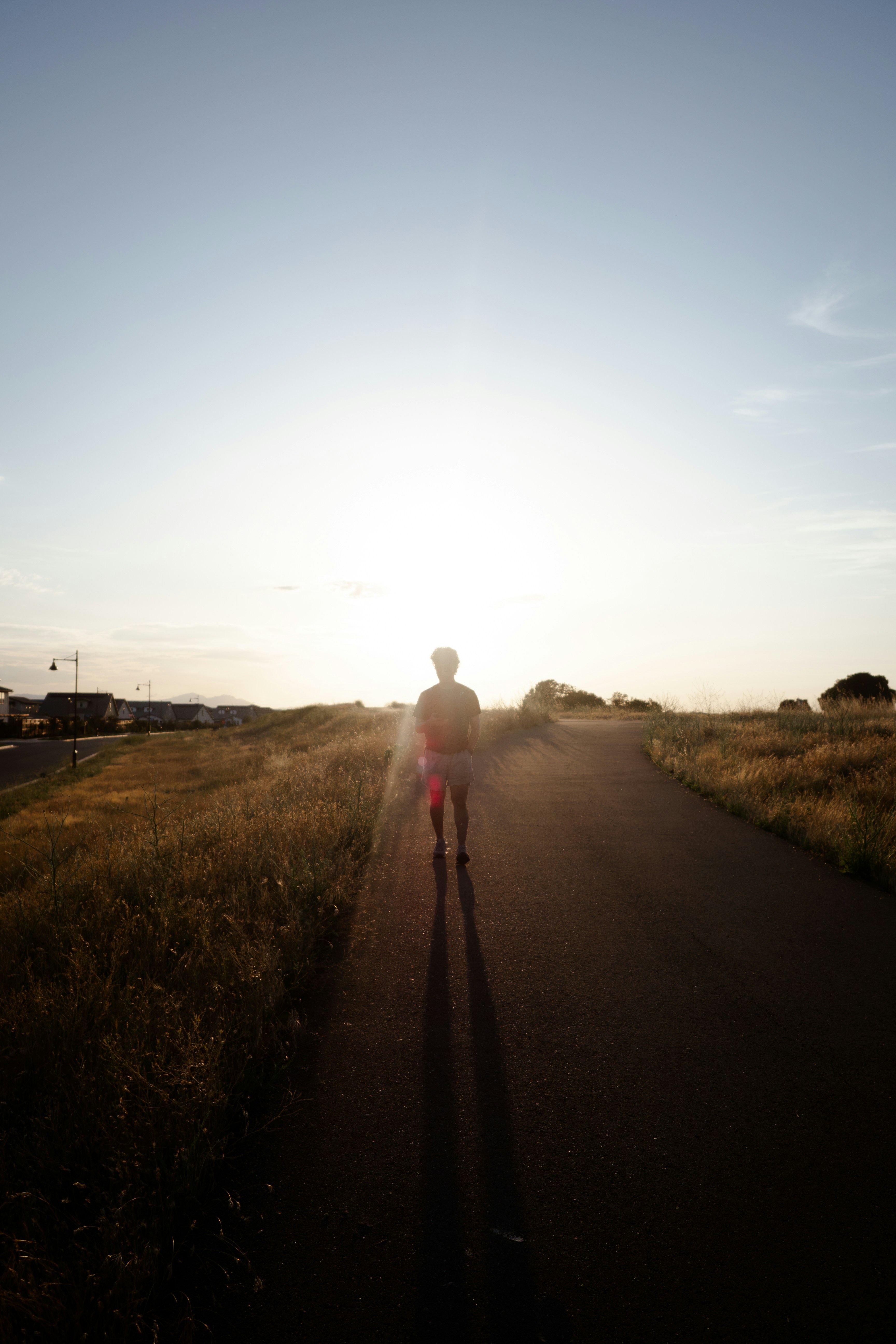 a person riding a skateboard down a road